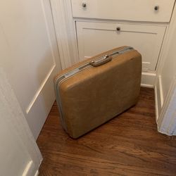 Vintage SAMSONITE hard-shell rolling luggage