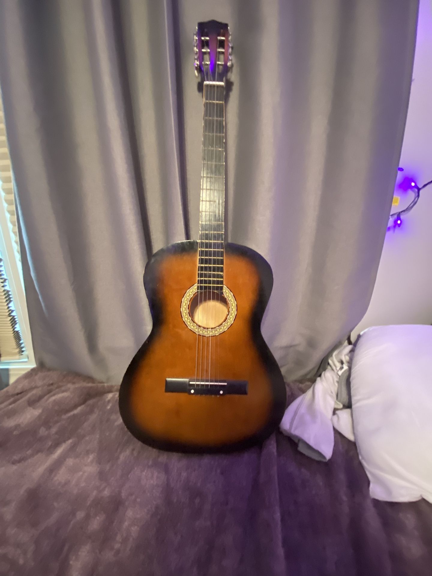 cherry wood guitar goes for $140