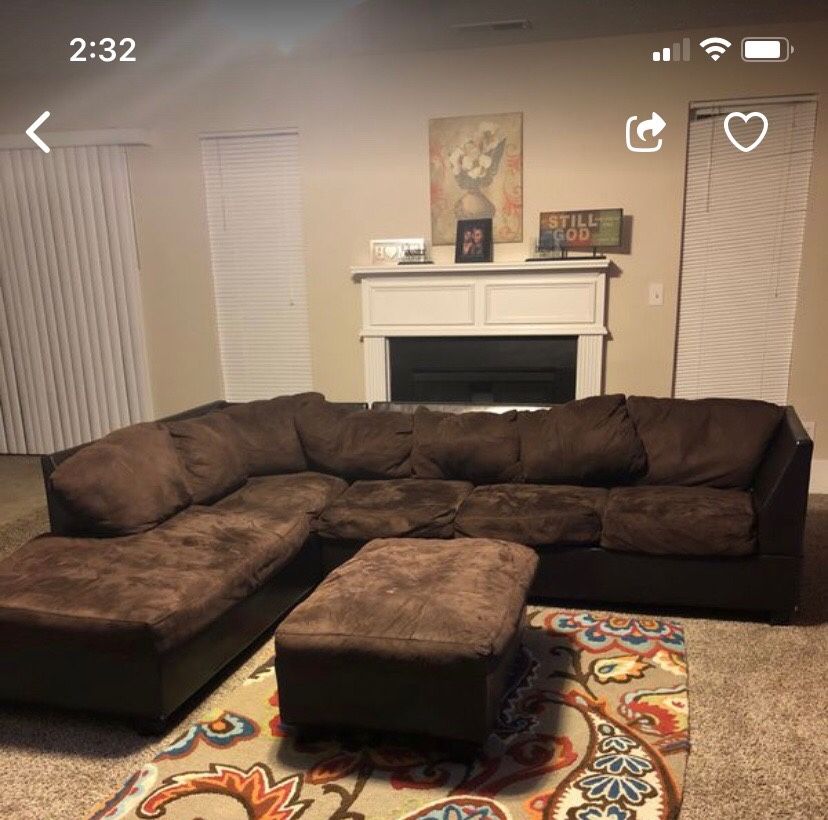 Chocolate sectional with leather bottom and ottoman