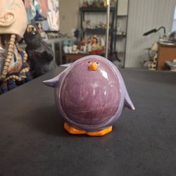 Novelty Round Glossy Ceramic Penguin Piggy Bank - Painted In Purple & Lavender W/Orange Beak & Feet-Has Plug On Bottom 4.25"Hx5"W