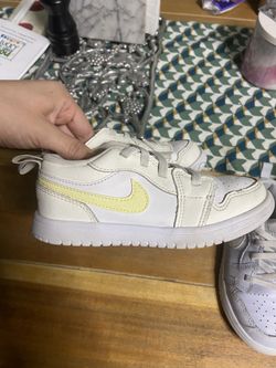 White and yellow Nike Jordan’s