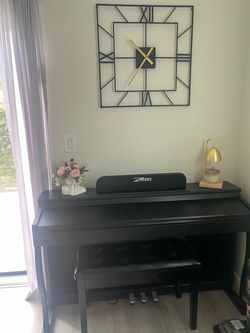 Electric piano and large chair with the storage