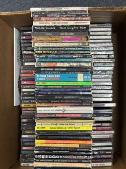 Diverse collection of music media includes over 330 CDs & several cassette tapes.