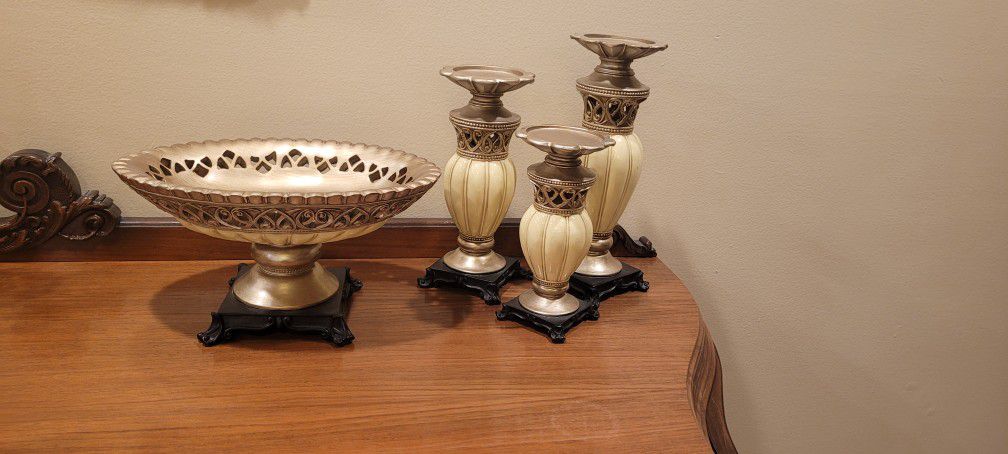 3 candle holders and a bowl set