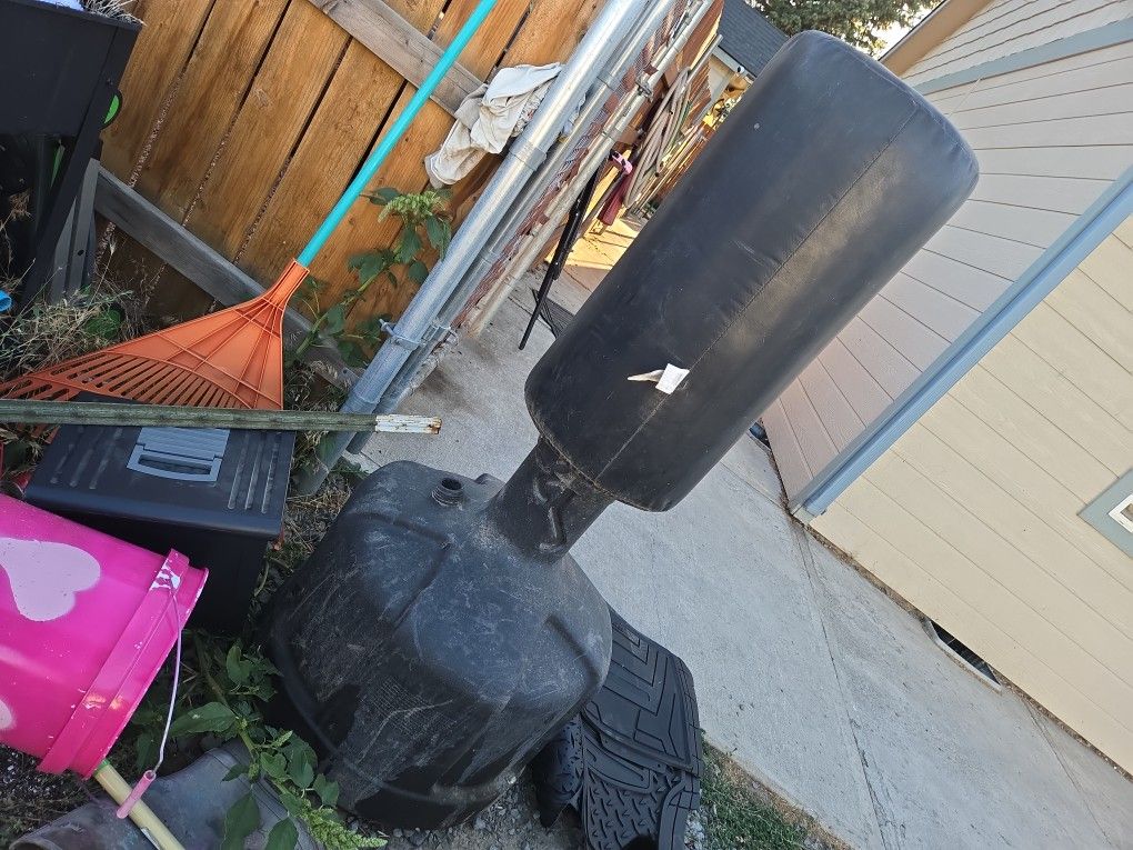 Punching bag , Bottom fills with sand or water.