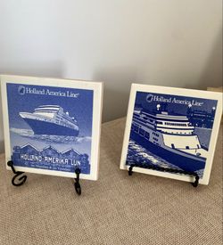 The Holland-America Line 4"X4" Art Deco Blue & White Porcelain Coasters are a highly sought-after vintage collectible set featuring a nautical theme. 