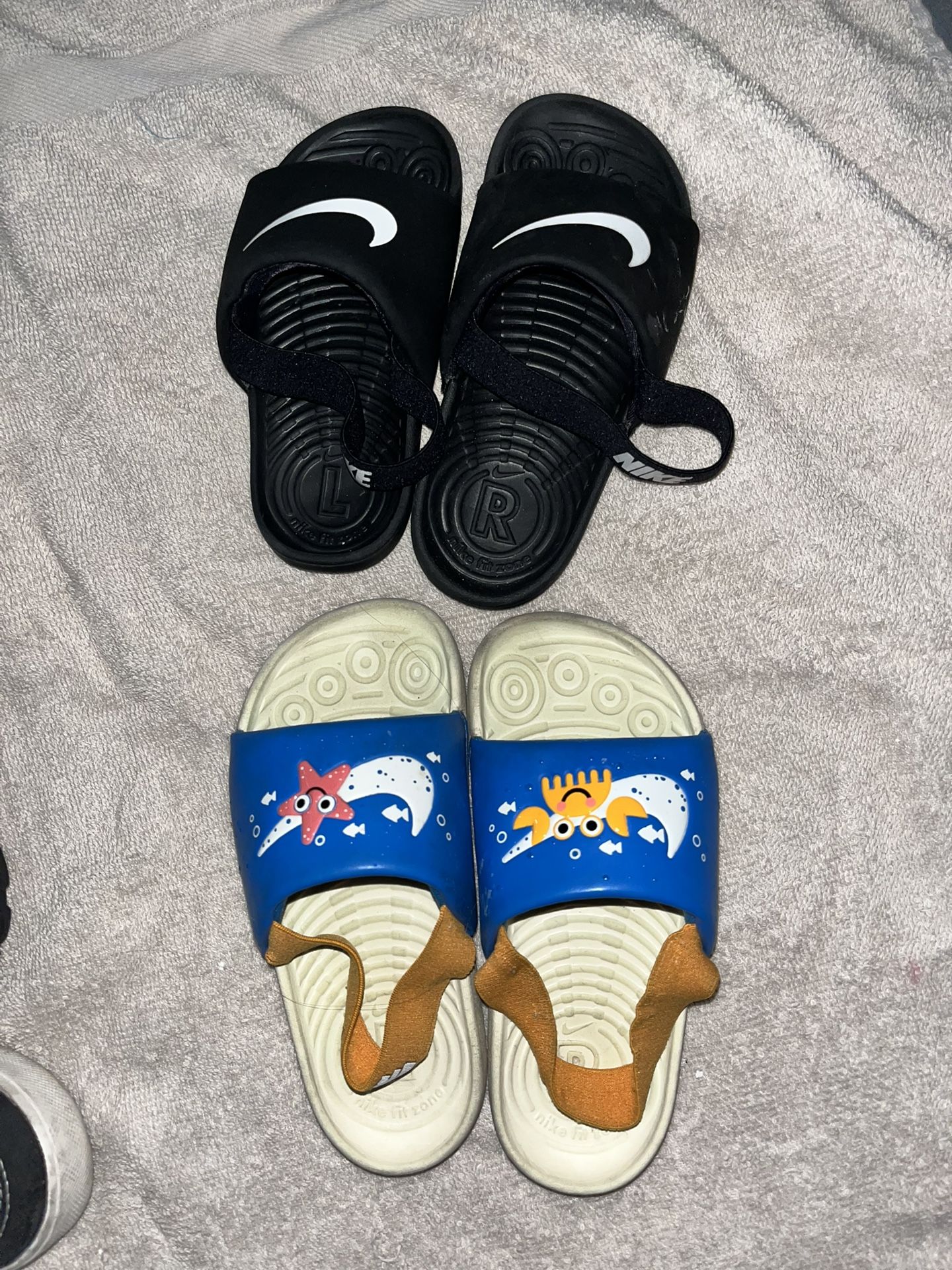 Two Nike Toddler Nike Slides