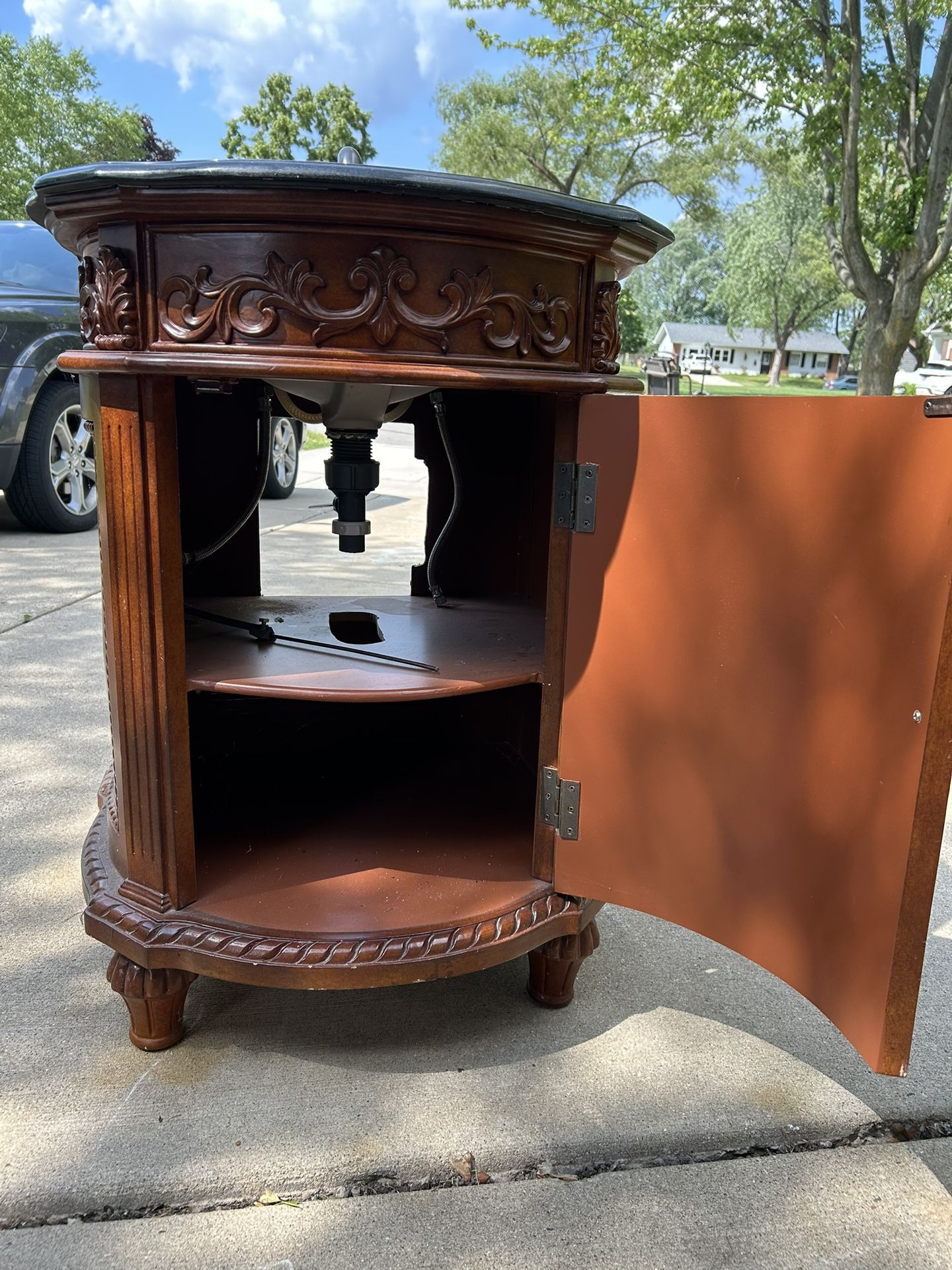 Ornate Wooden Cabinet With Marble Top And Granite