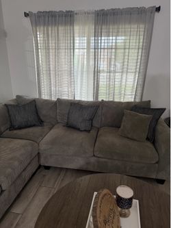 Grey couch. Includes 2 same fabric pillows.