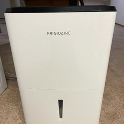 Frigidaire 50 Pint 1200 Sq Ft High Humidity Dehumidifier with Built In Pump And Bucket In White