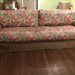 2 Rattan Couches With Red Monkey Fabric