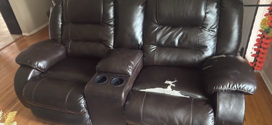Two piece sofa set black leather one sofa perfect condition the other is peeling