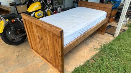 Wooden bed frame and mattress