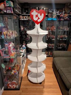 TY Beanie Babies / Beanie Boos rotating retail store display stand featuring the iconic red-and-white "ty" heart logo at the top