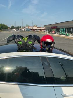 Youth football shoulder pads size large 14-15 and helmet size xL both together for 200