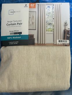 Beige textured curtain pair