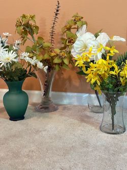 Four vases with flowers