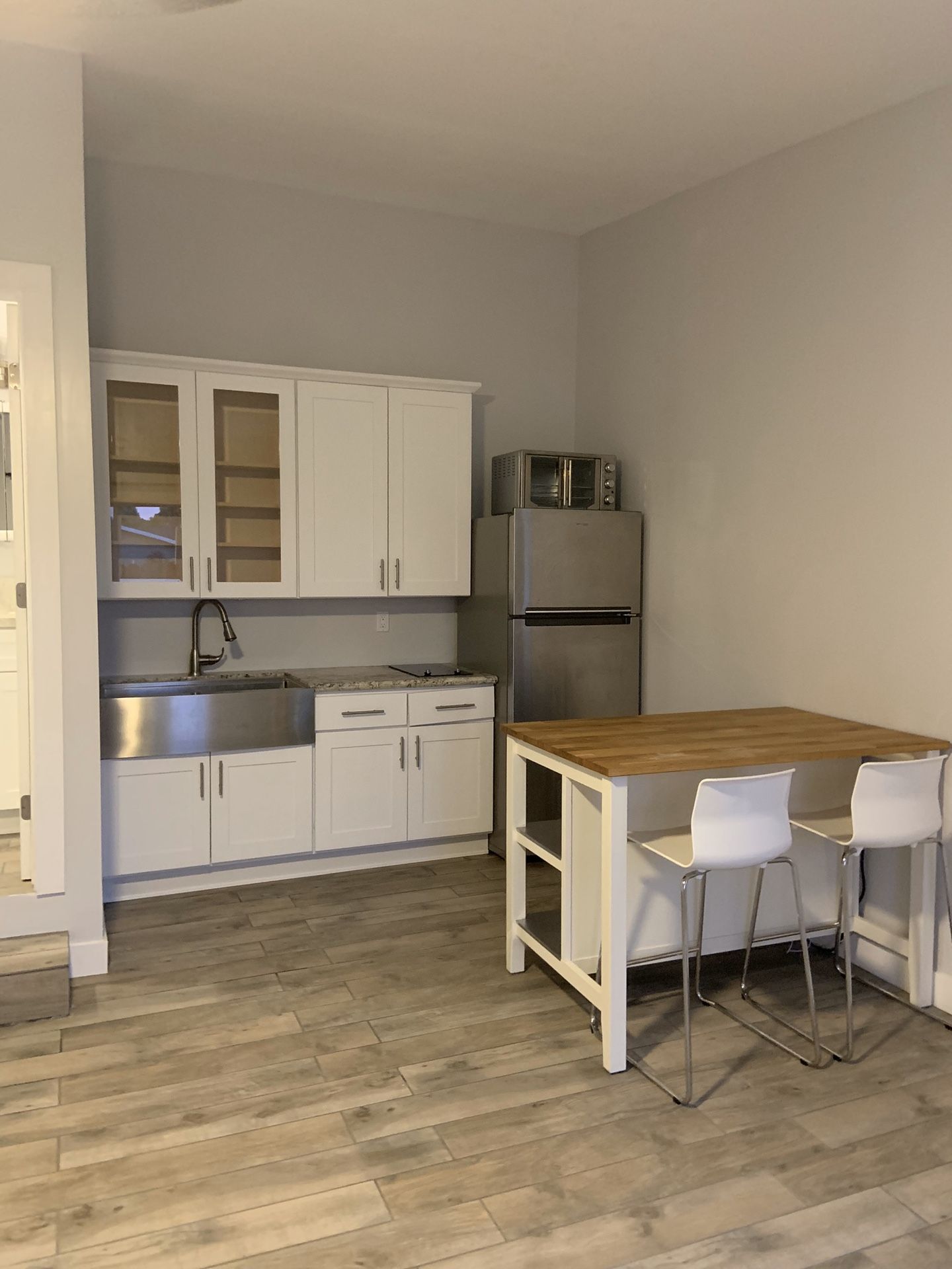 Kitchen island with two barstools