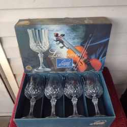 A set of 4-7 1/2oz Cristal D'Arques Longchamp stemmed crystal goblets in their original box.