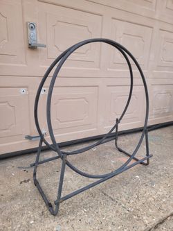 Black metal circular firewood rack tubular