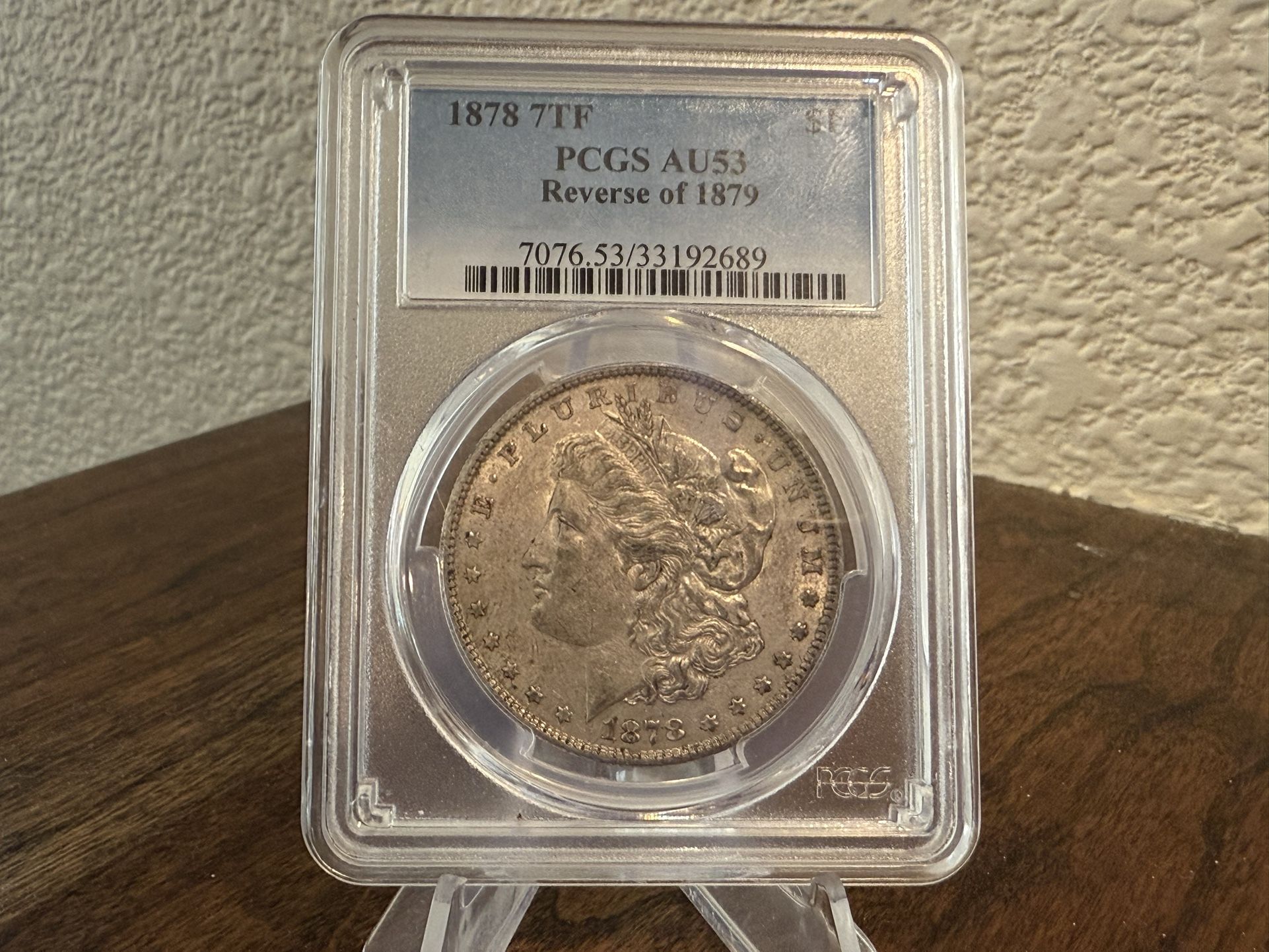 1878 7TF PCGS AU53 Reverse of 1879 Morgan Silver Dollar