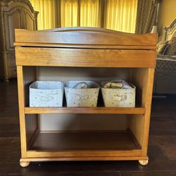 baby crib with a baby changing table