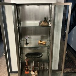 Unique, stainless steel display cabinet
