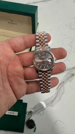Model Number: 126231 Rolex Datejust 36mm Chocolate Index Dial Two Tone Everose Gold Fluted Bezel Jubilee Bracelet  Is great condition bought from the