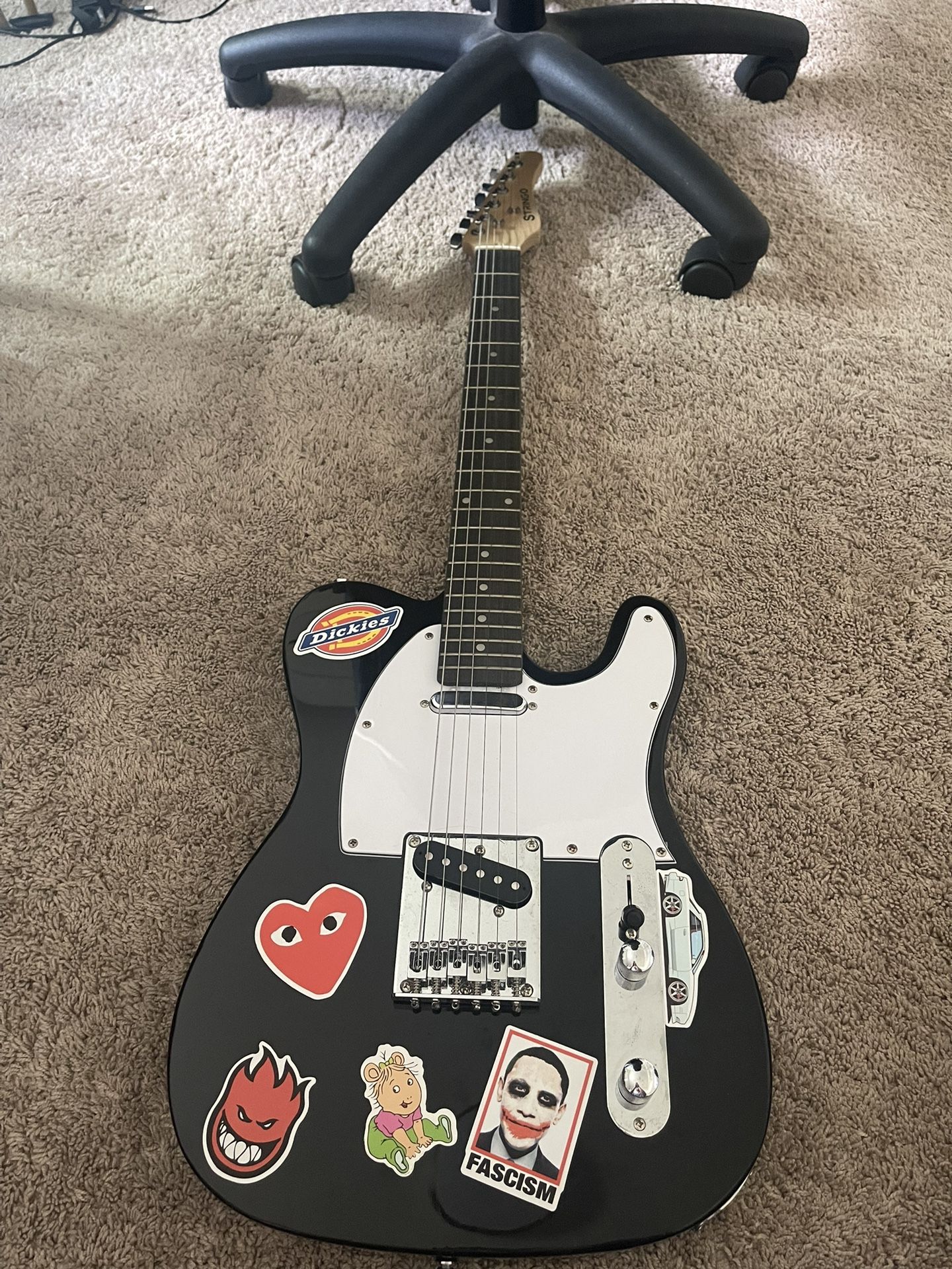 Black Electric Guitar & Amplifier 