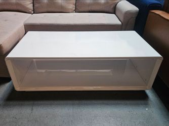 Assorted glossy white coffee tables