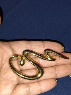 Goldtone snake brooch