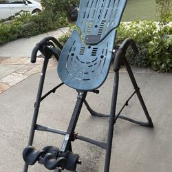 Become taller. The famous Teeter inversion back relief machine