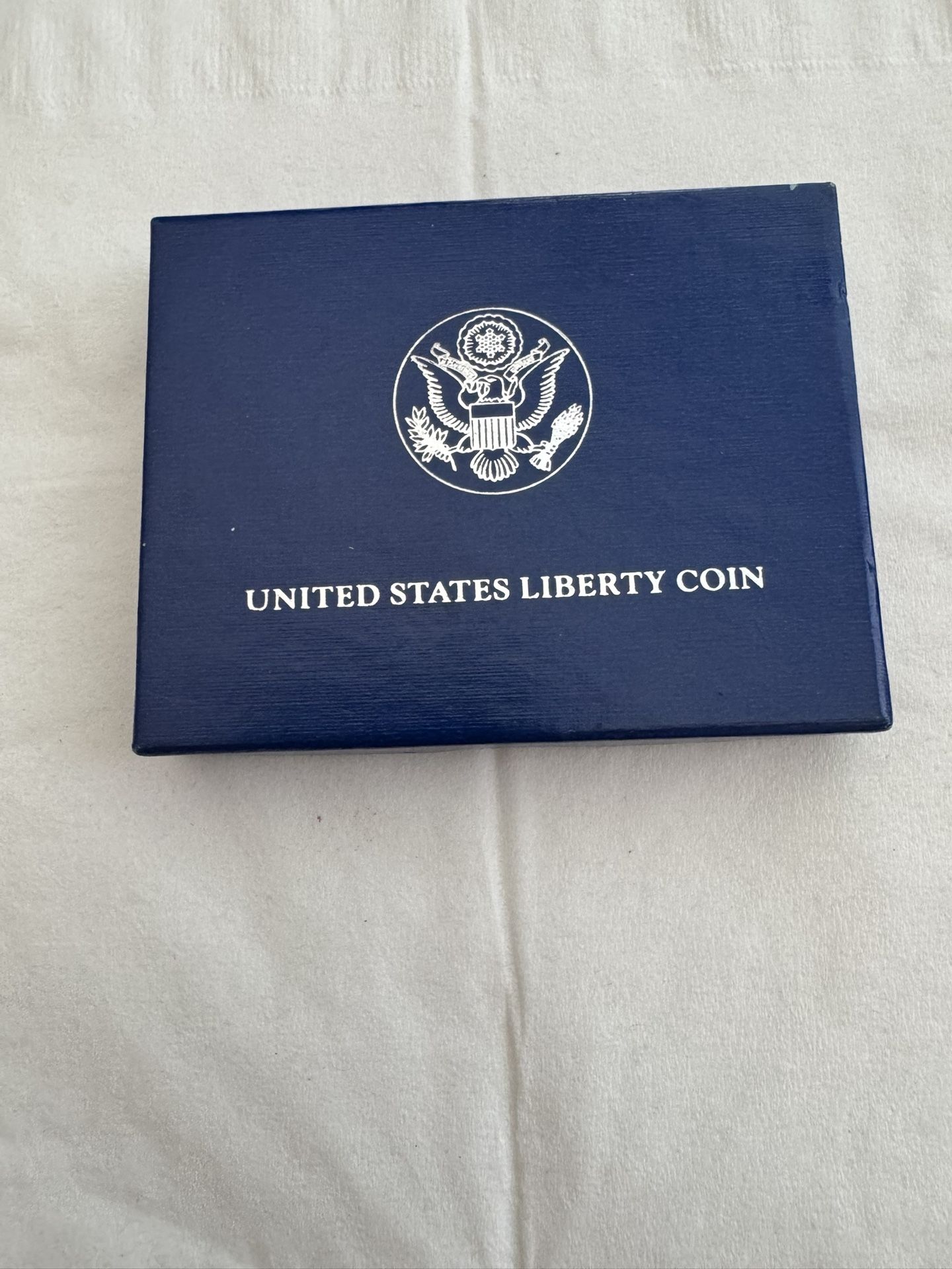 LIBERTY HALF DOLLAR COIN WITH CASE, MINT CONDITION.