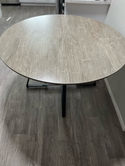 Round Grey Wood Grain Dining Table with Black Metal Base