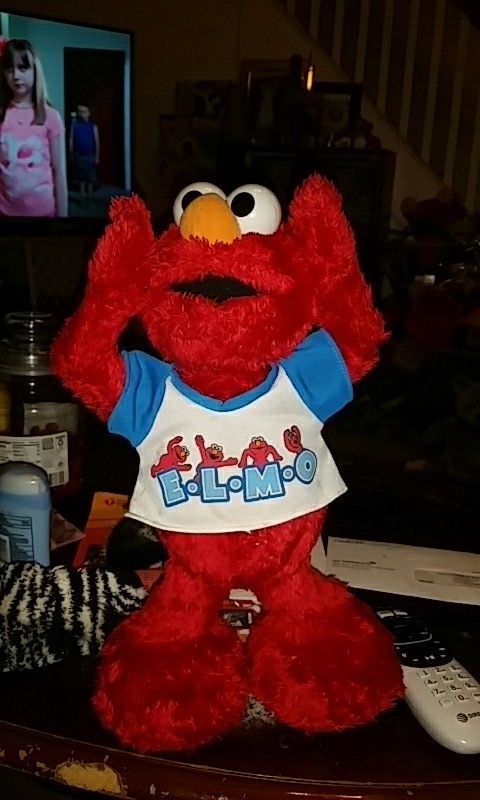 Talking elmo spells out elmo like the ymca