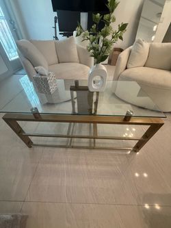 Glass and gold accent coffee table with shelf
