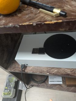 Xbox Series S 512GB hard drive with Xbox controller and 1TB Hard drive.