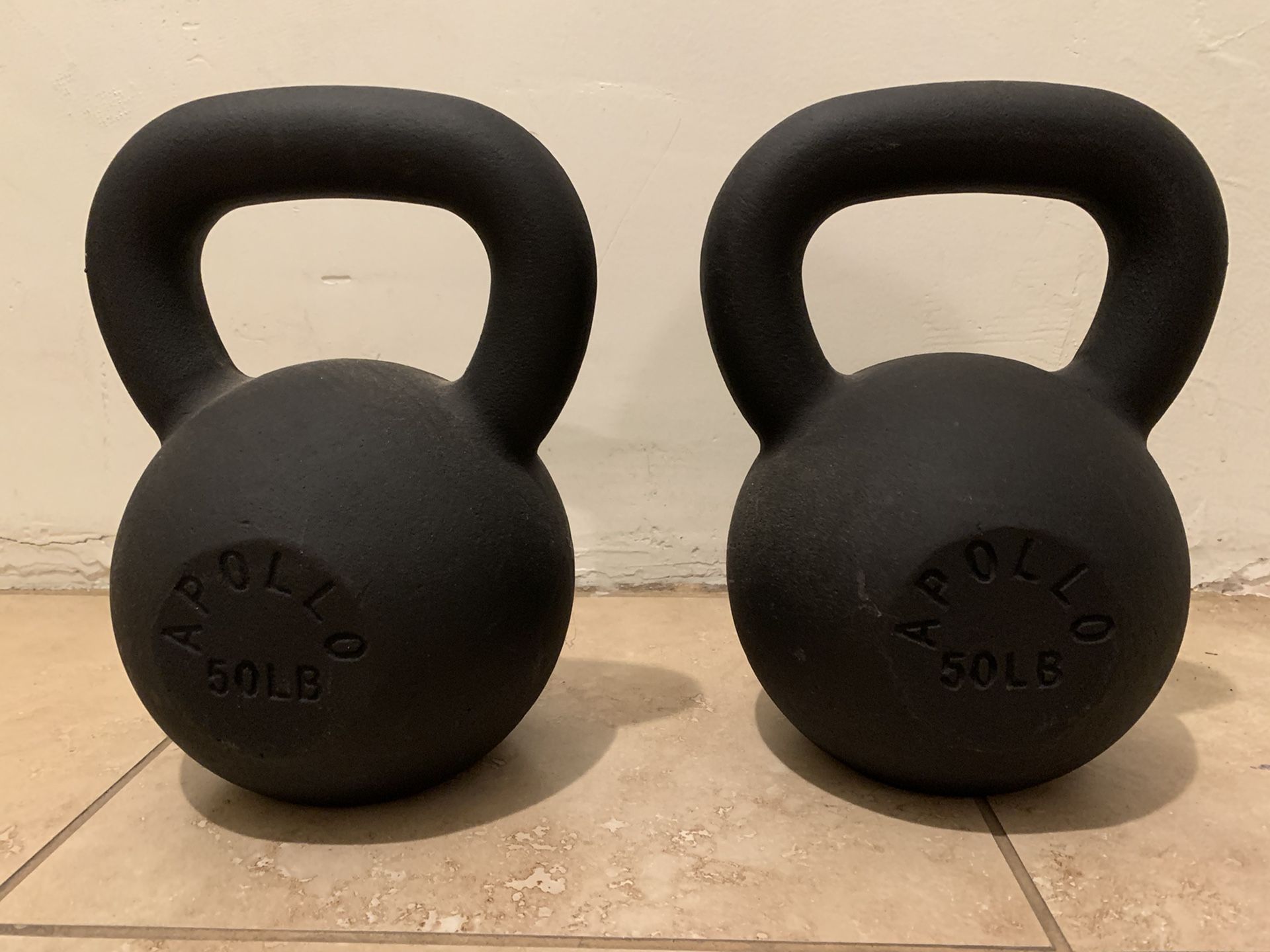 Two Apollo 50 lb. kettlebells