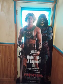 Life size cut out of he man and skelator