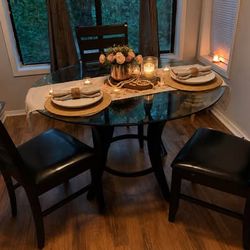 Mesa de comedor redonda de vidrio con 4 sillas