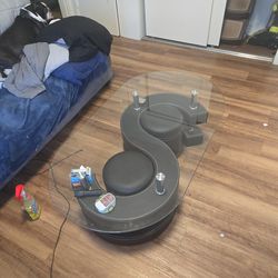 Clear coffee table with two stools