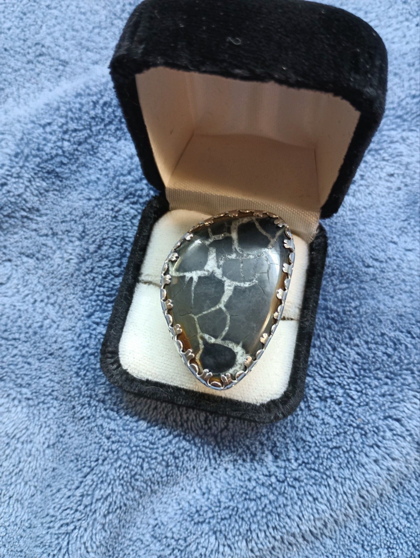 Ring. 925 Sterling the stone is a dragon serpent Stone.