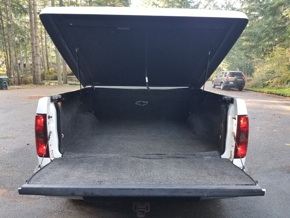 Hard tonneau cover for Silverado or Sierra truck bed with rug