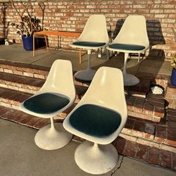 Four mcm tulip chairs