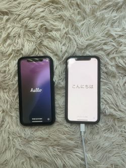 Two Apple iPhones with Cases