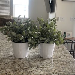 Two Small Faux Plants In Decorative Pots 
