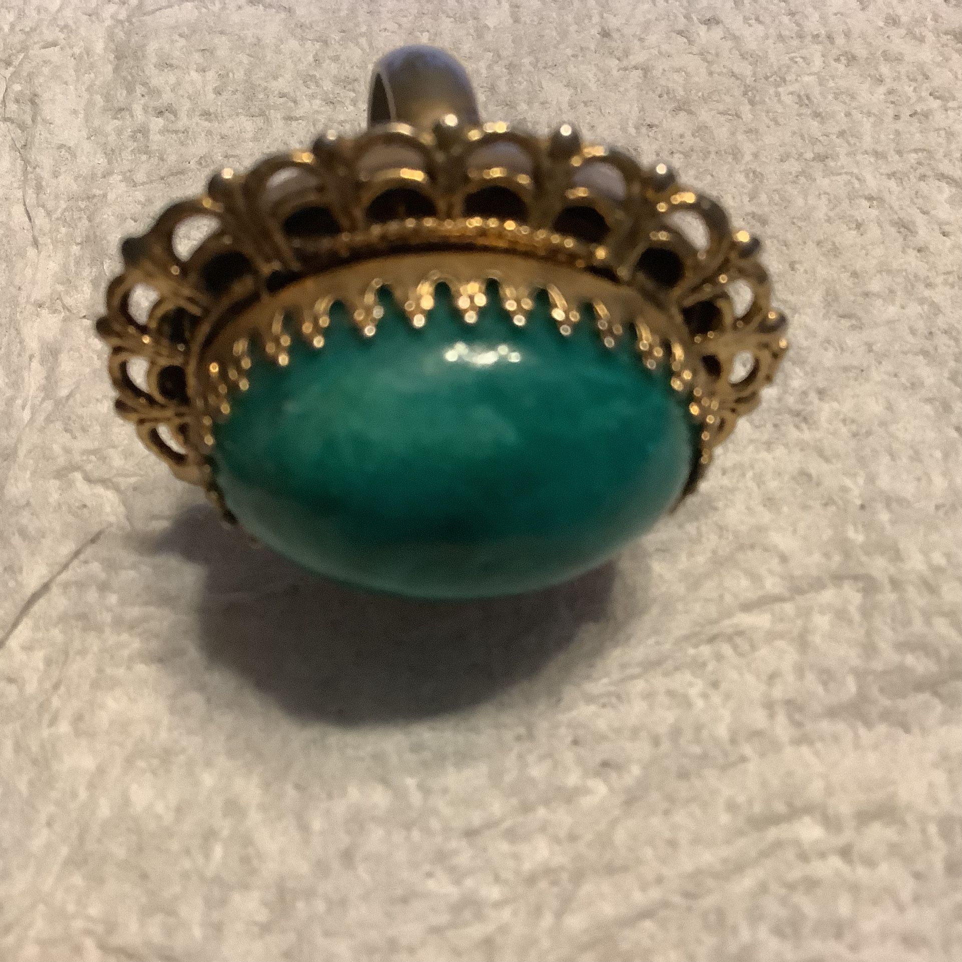 1960s Turquoise Ring Encased In A Beautiful Gold Color Clamps