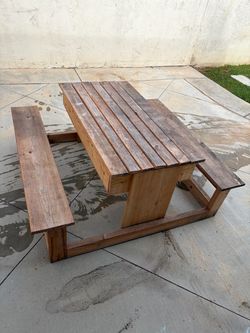 Children’s picnic table with sensory bins inside