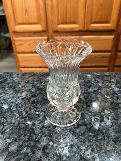 Beautiful lead crystal vase .  Size 4 1/4 inches tall.  Brand new no markings or brand.  Has been on display in a curio cabinet.