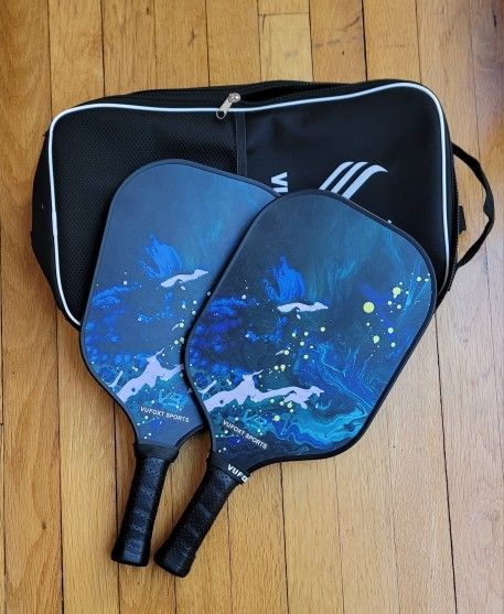 Two pickleball paddles and case